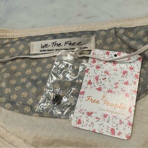 NWT FREE PEOPLE SZ S WE THE FREE JADE LONG SLEEVE POCKET HI-LOW TEE ECRU (Beige)